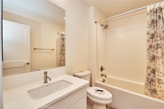 full bathroom featuring shower / bath combo with shower curtain, toilet, and vanity