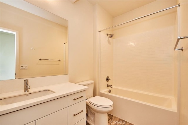 full bathroom with vanity, toilet, wood finished floors, and  shower combination