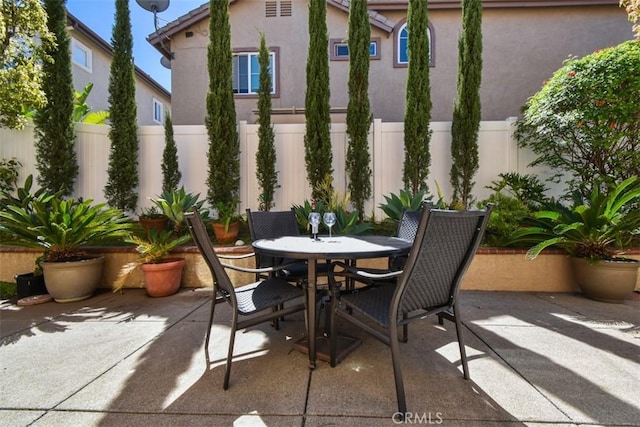 view of patio / terrace with outdoor dining area and a fenced backyard