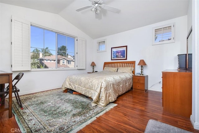 bedroom with vaulted ceiling, wood finished floors, baseboards, and ceiling fan