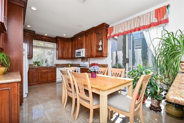 dining space featuring recessed lighting