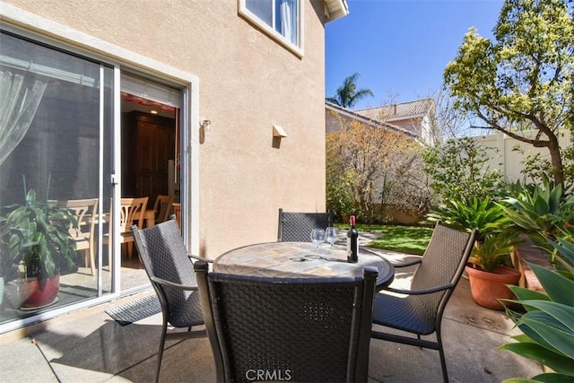 view of patio featuring outdoor dining area and a fenced backyard