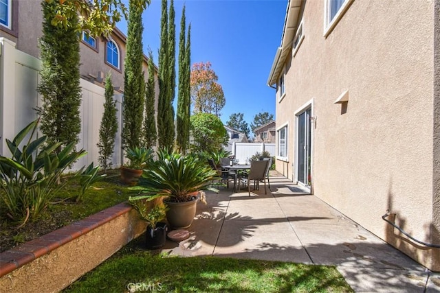 view of patio / terrace with a fenced backyard and outdoor dining space