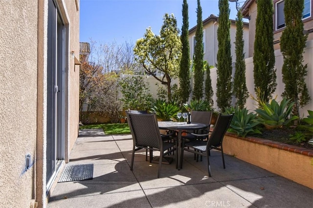 view of patio / terrace featuring outdoor dining area and a fenced backyard