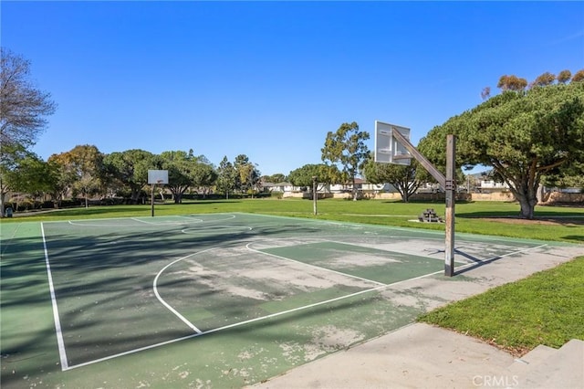 view of basketball court featuring a yard and community basketball court