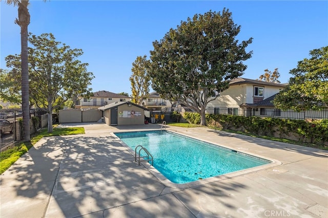 view of pool featuring a fenced in pool, a patio, and fence