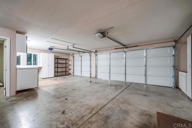 garage featuring a garage door opener