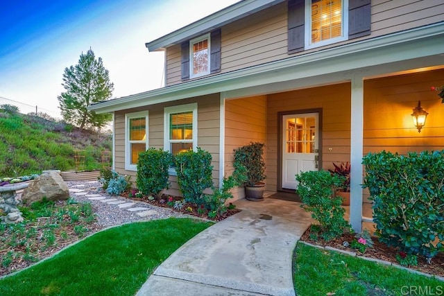 property entrance with covered porch