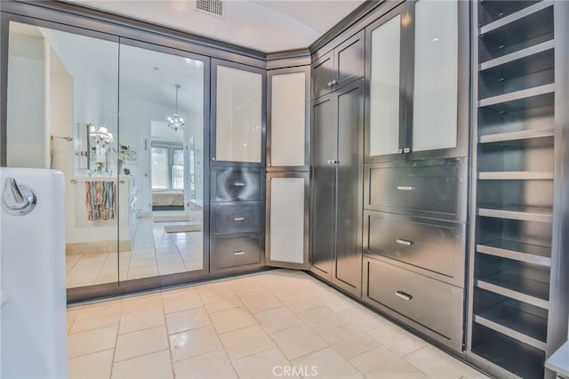 bathroom featuring tile patterned floors and visible vents