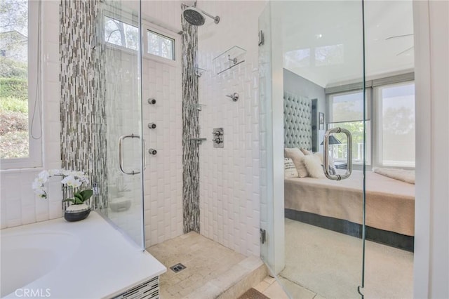 bathroom featuring tile patterned flooring and a stall shower