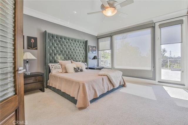 bedroom featuring a ceiling fan, ornamental molding, carpet flooring, and access to outside