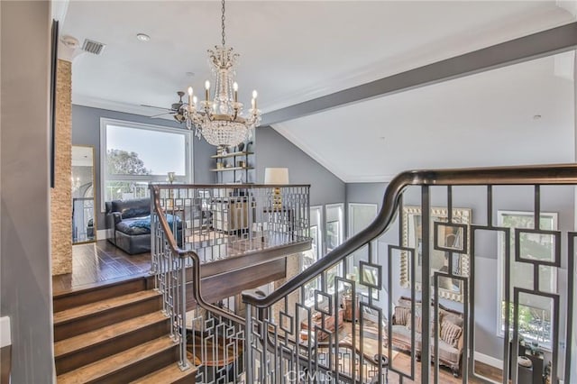 staircase featuring a notable chandelier, wood finished floors, visible vents, and vaulted ceiling with beams