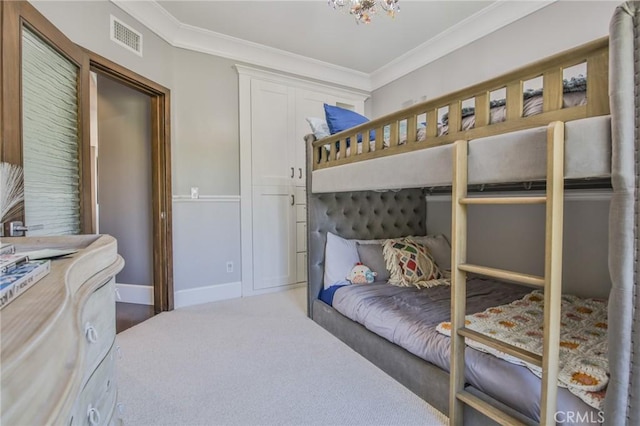 bedroom with visible vents, baseboards, carpet floors, and ornamental molding