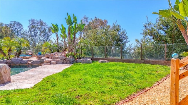 view of yard featuring fence