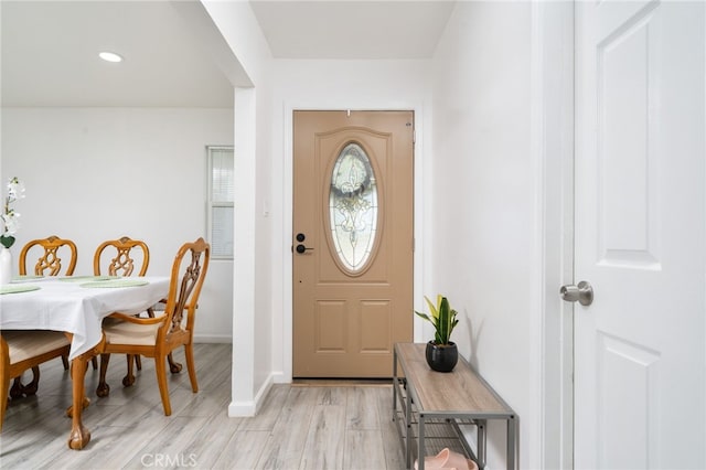 entryway featuring recessed lighting, light wood-type flooring, and baseboards