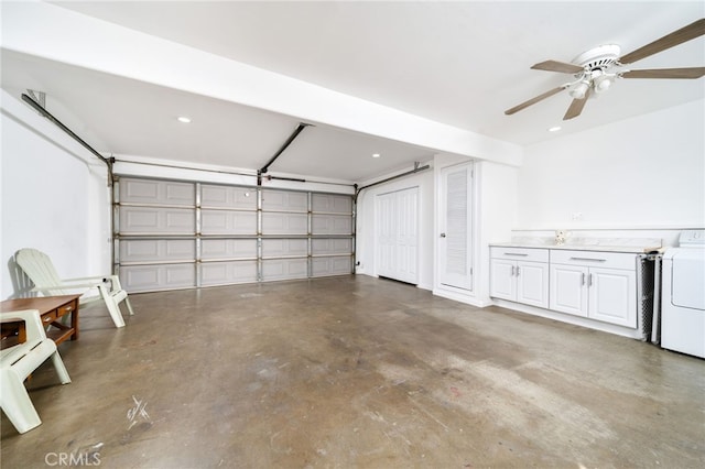 garage featuring recessed lighting and washer / clothes dryer