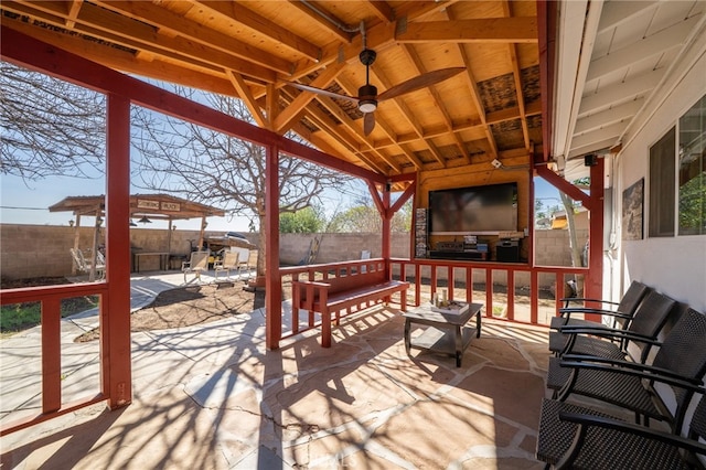 deck with a patio area and a fenced backyard