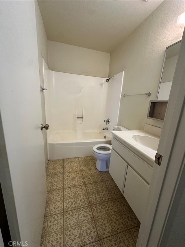 full bathroom featuring tile patterned flooring, shower / bathing tub combination, toilet, and vanity