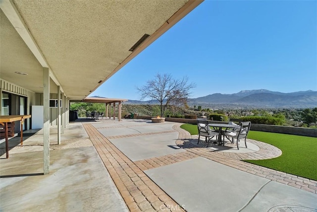 view of patio / terrace featuring a mountain view