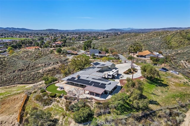 drone / aerial view featuring a mountain view