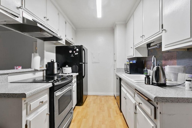 kitchen featuring under cabinet range hood, stainless steel electric stove, dishwasher, light wood-style flooring, and white cabinets