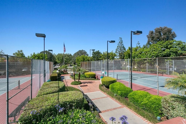 view of sport court with fence