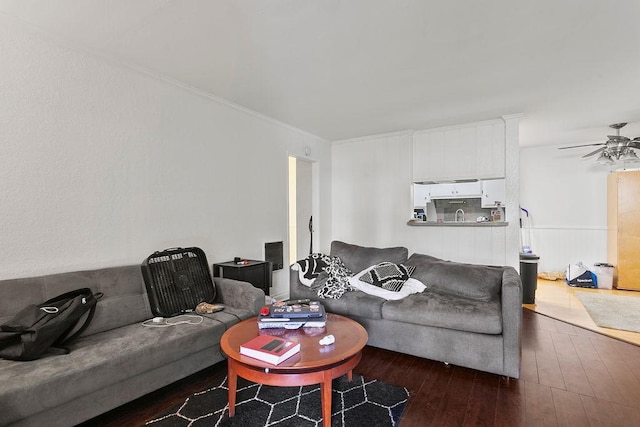 living room with ceiling fan and hardwood / wood-style floors