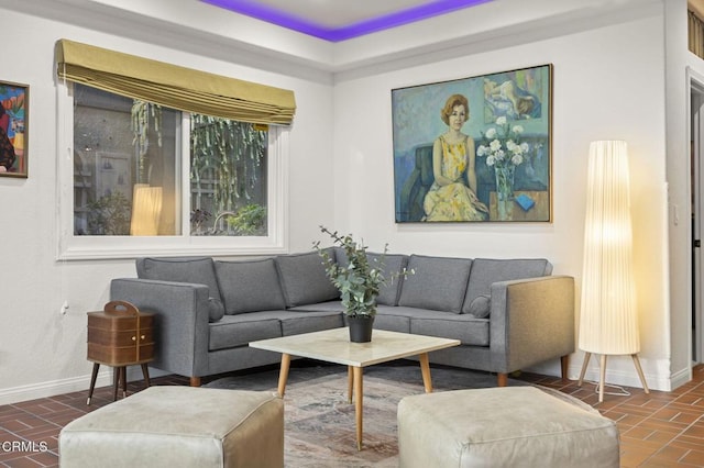 living room with brick floor and baseboards