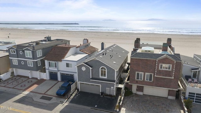 aerial view with a beach view and a water view