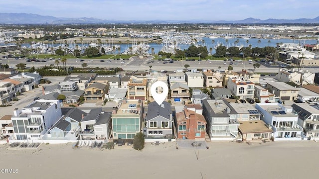 birds eye view of property featuring a residential view and a water and mountain view