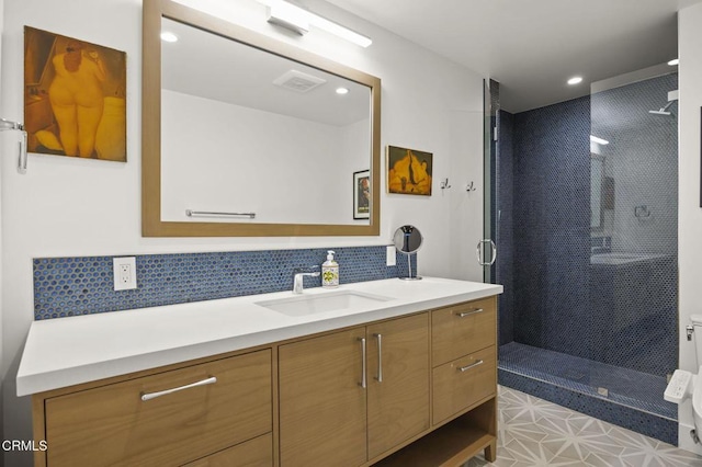 bathroom with visible vents, a stall shower, recessed lighting, decorative backsplash, and vanity