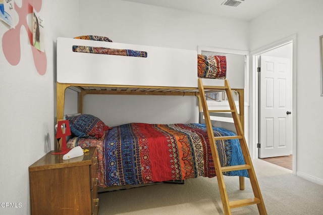 bedroom with carpet flooring, baseboards, and visible vents