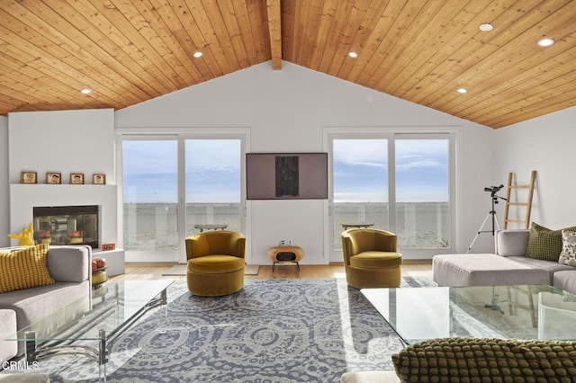 living room with wood ceiling, a glass covered fireplace, vaulted ceiling with beams, and wood finished floors