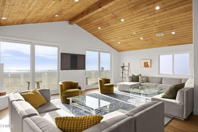 living area with wood ceiling, recessed lighting, wood finished floors, and a healthy amount of sunlight