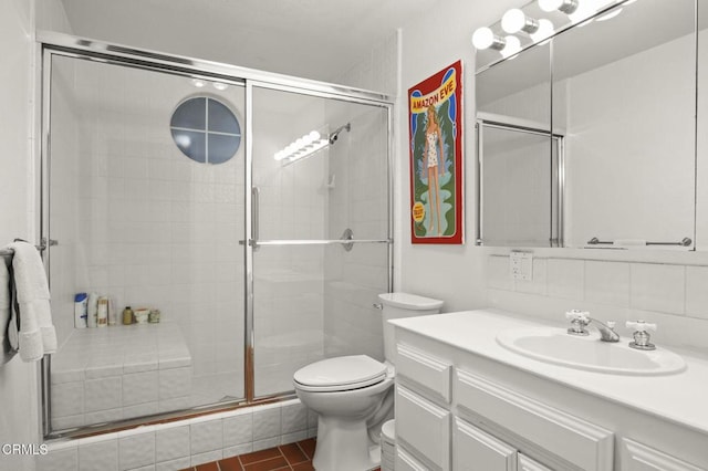 full bath with tile patterned floors, a shower stall, toilet, and vanity