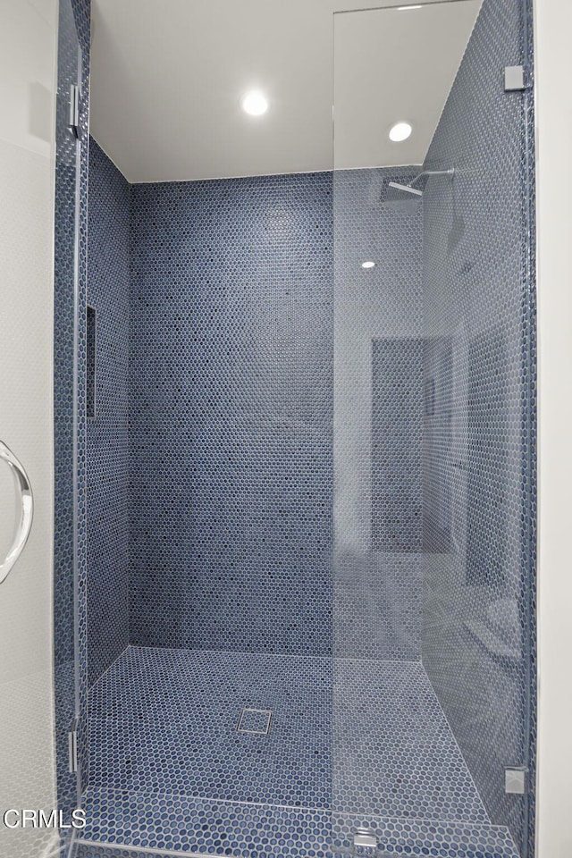 full bath featuring a shower stall