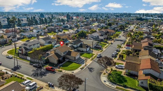 birds eye view of property with a residential view