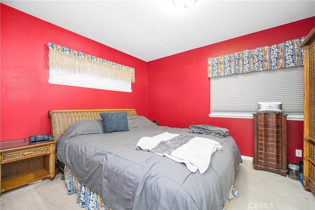 carpeted bedroom with a textured ceiling