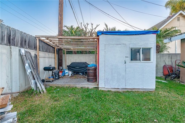 view of outbuilding with an outbuilding and a fenced backyard