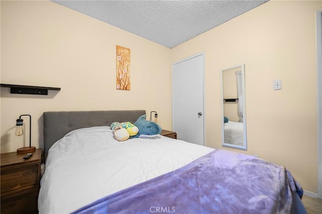 bedroom featuring a textured ceiling