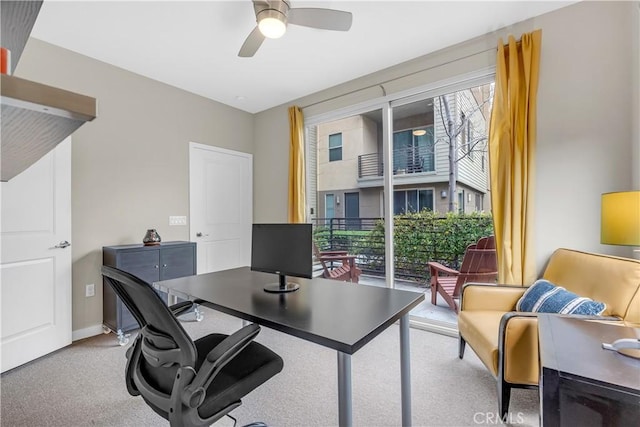 office with carpet, a ceiling fan, and baseboards