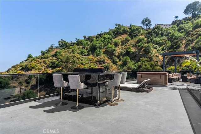 view of patio with a hot tub