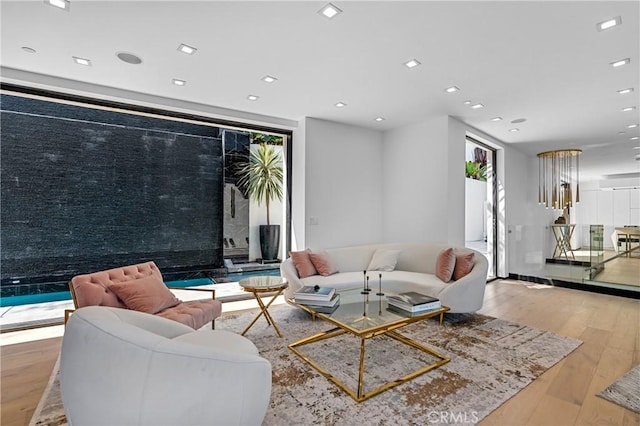 living room with recessed lighting and wood finished floors