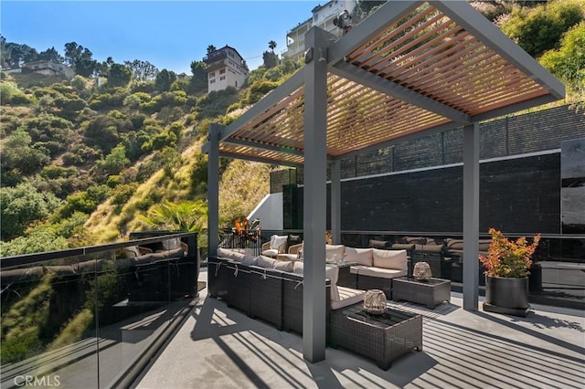 view of patio / terrace featuring an outdoor living space and a pergola