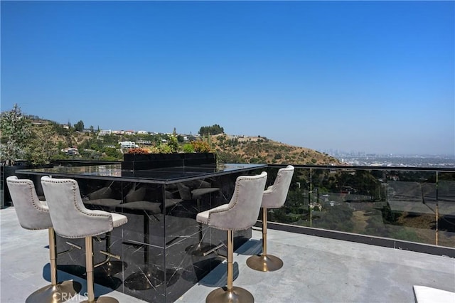 view of patio / terrace with a balcony