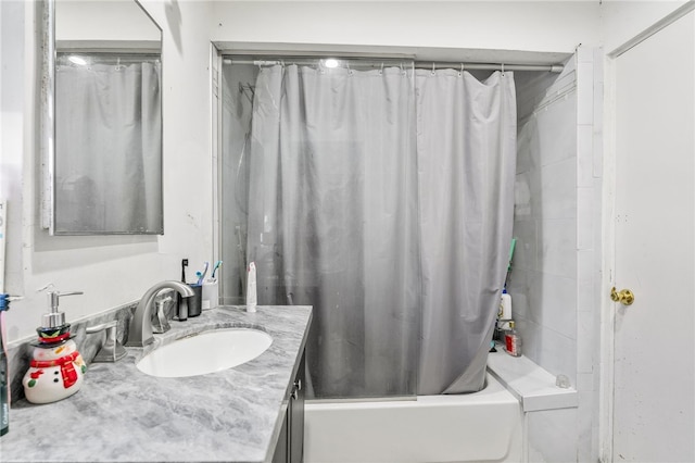 full bathroom featuring shower / bath combo with shower curtain and vanity