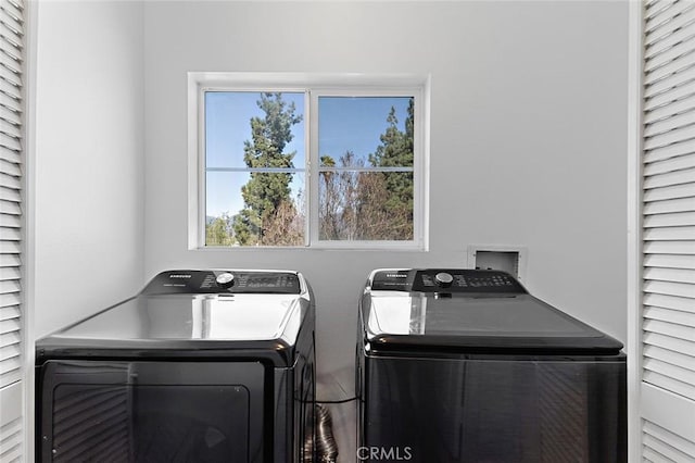 laundry room with washing machine and dryer and laundry area