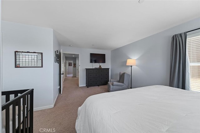 bedroom featuring carpet flooring and baseboards