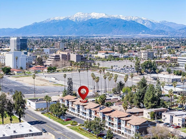 aerial view featuring a mountain view and a view of city