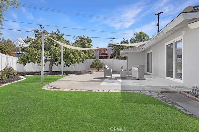 view of yard featuring a patio, a fenced backyard, and outdoor lounge area